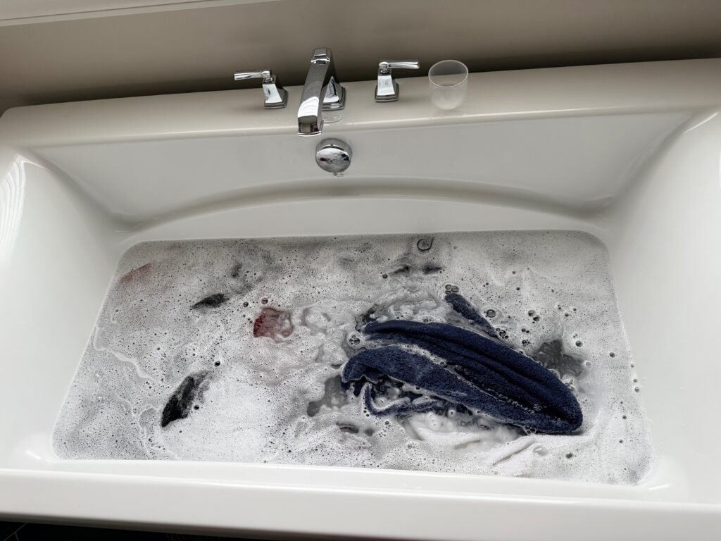 Clean towels soaking in hot water before stripping process begins